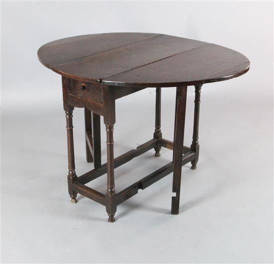 A late 17th century oak gateleg table, W.2ft 9in. H.2ft 4in.